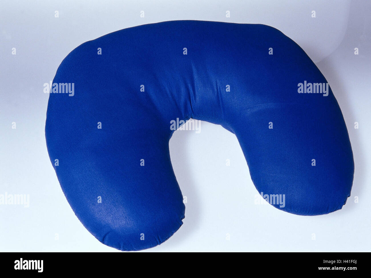 Nape croissants headrest, blue, supporting cushions, nape prop, travel cushion, ergonomics, ergonomically, prophylaxis, spannings, nape spanning, product photography, Still life, studio Stock Photo