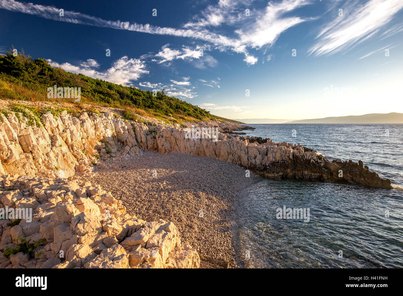 Sunrise over the rocky beach on the coast of Adriatic Sea, Istria, Croatia Stock Photo