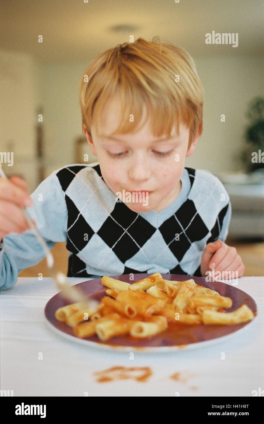 Boy, food, pasta dish, child, 7 years, larders, dish, noodles, ketchup, tomato sauce, hunger, appetite Stock Photo