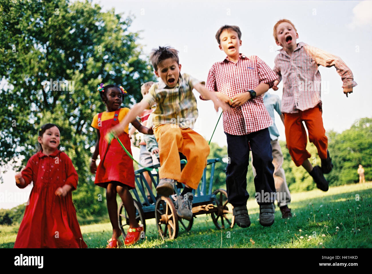 Children, group, skin colour differently, handcarts, game, fun, caper, summer, outside youth, childhood, friends, friendship, boy, girl, nationality, passed away, difference, leisure time, amusement, happy, melted, lighthearted, carriages, conductor carri Stock Photo
