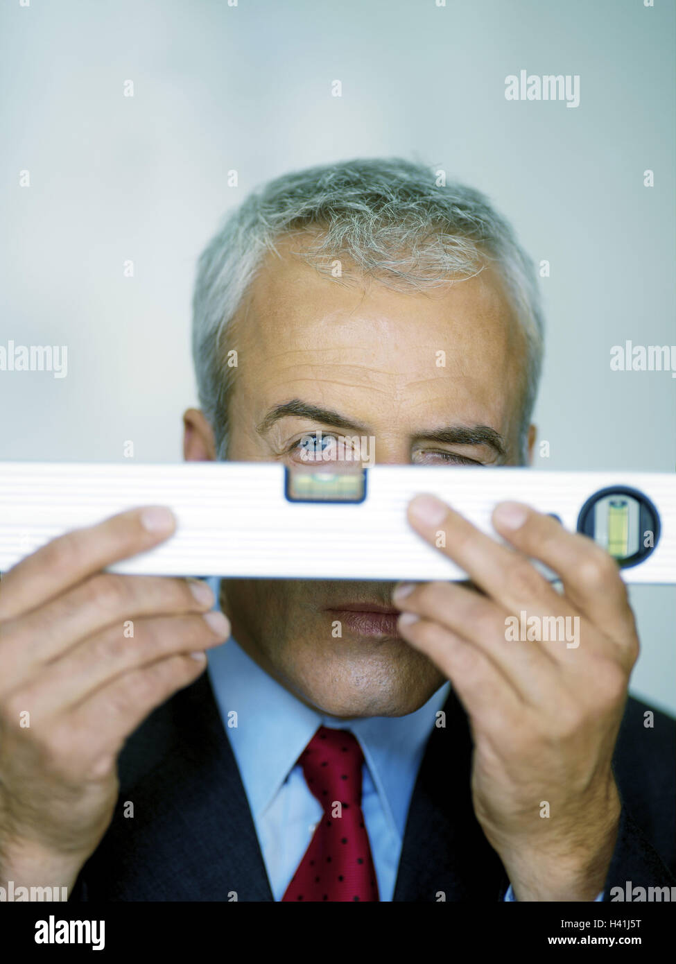 Man, grey-haired, middle old person, suit, level, portrait, businessman, manager, seriously, concentrates, Setzwaage, testing set, icon, balance, weigh, controls, accuracy, precision, meticulousness, measurement, exactly, studio, Stock Photo