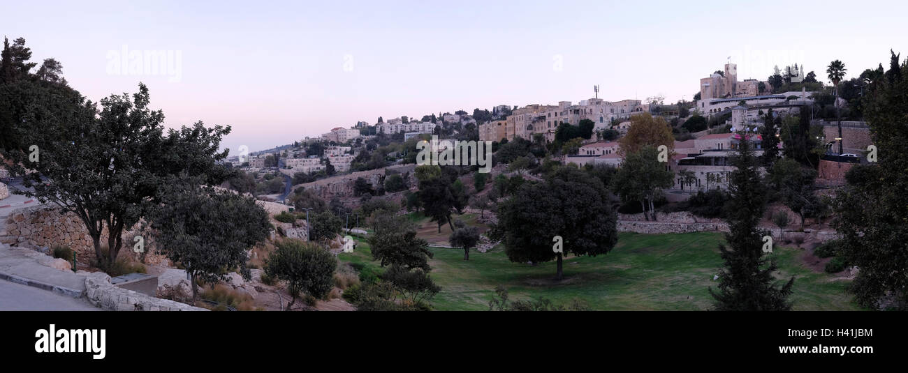 View toward Abu Tor a mixed Jewish and Arab neighborhood located over valley of Hinnom the modern name for the biblical Gehenna or Gehinnom valley surrounding Jerusalem's Old City, Israel Stock Photo