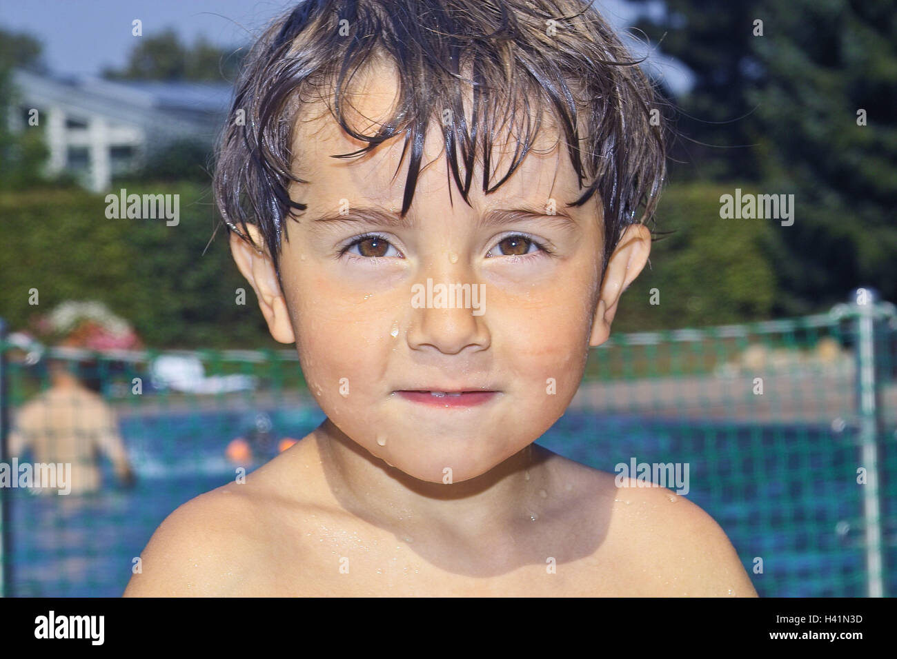 Outdoor swimming pool, boy, hairs wet, portrait, child portrait Stock
