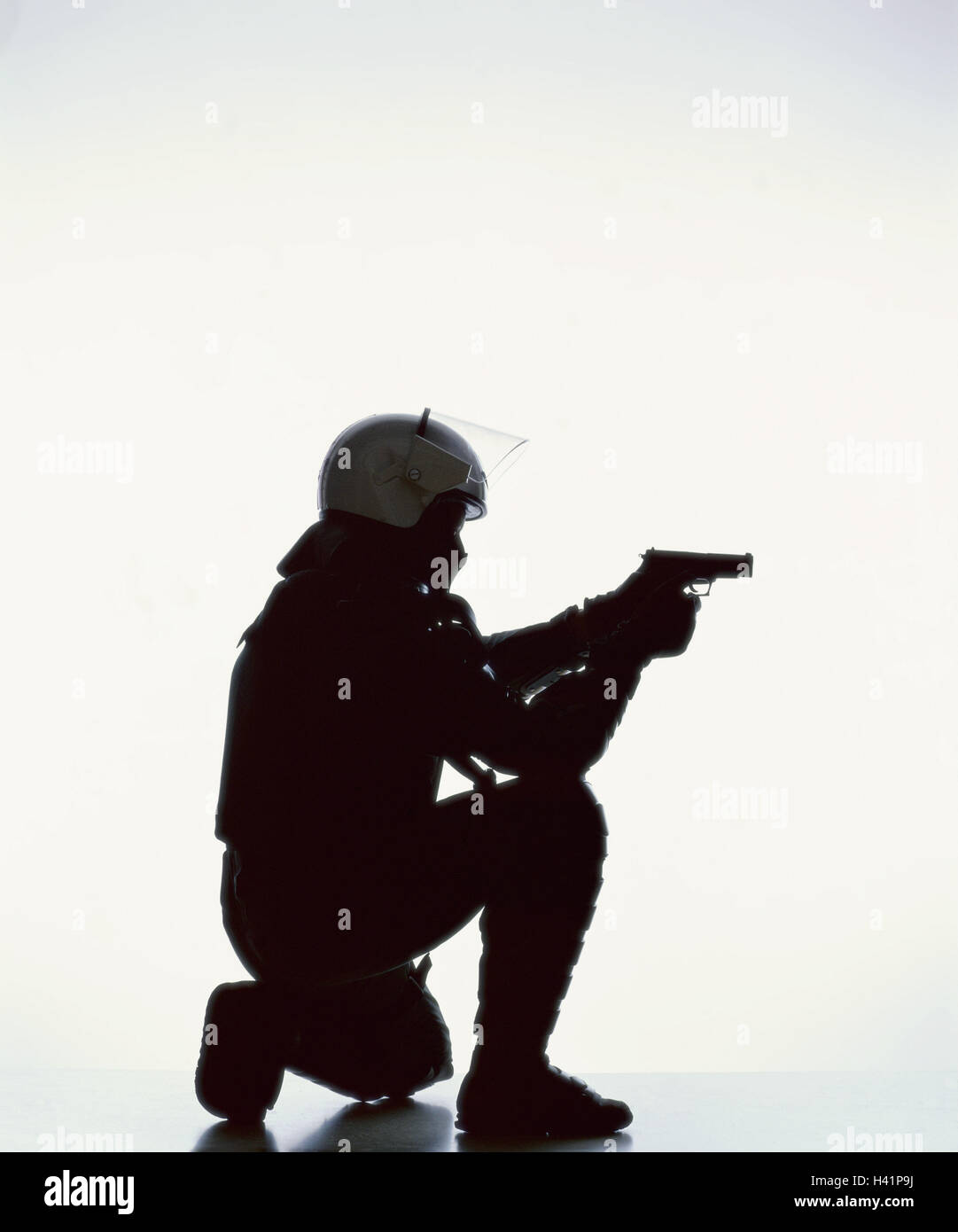 Special task force, silhouette, policeman, kneel, weapon, aim, side view, man, police officer, protective clothing, helmet, gun, shoot, protection, official, special unit, special police, protection, defence, defence, protection the borders group, GSG 9, Stock Photo