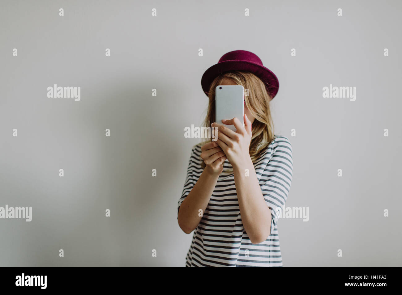Woman taking a selfie on her phone Stock Photo