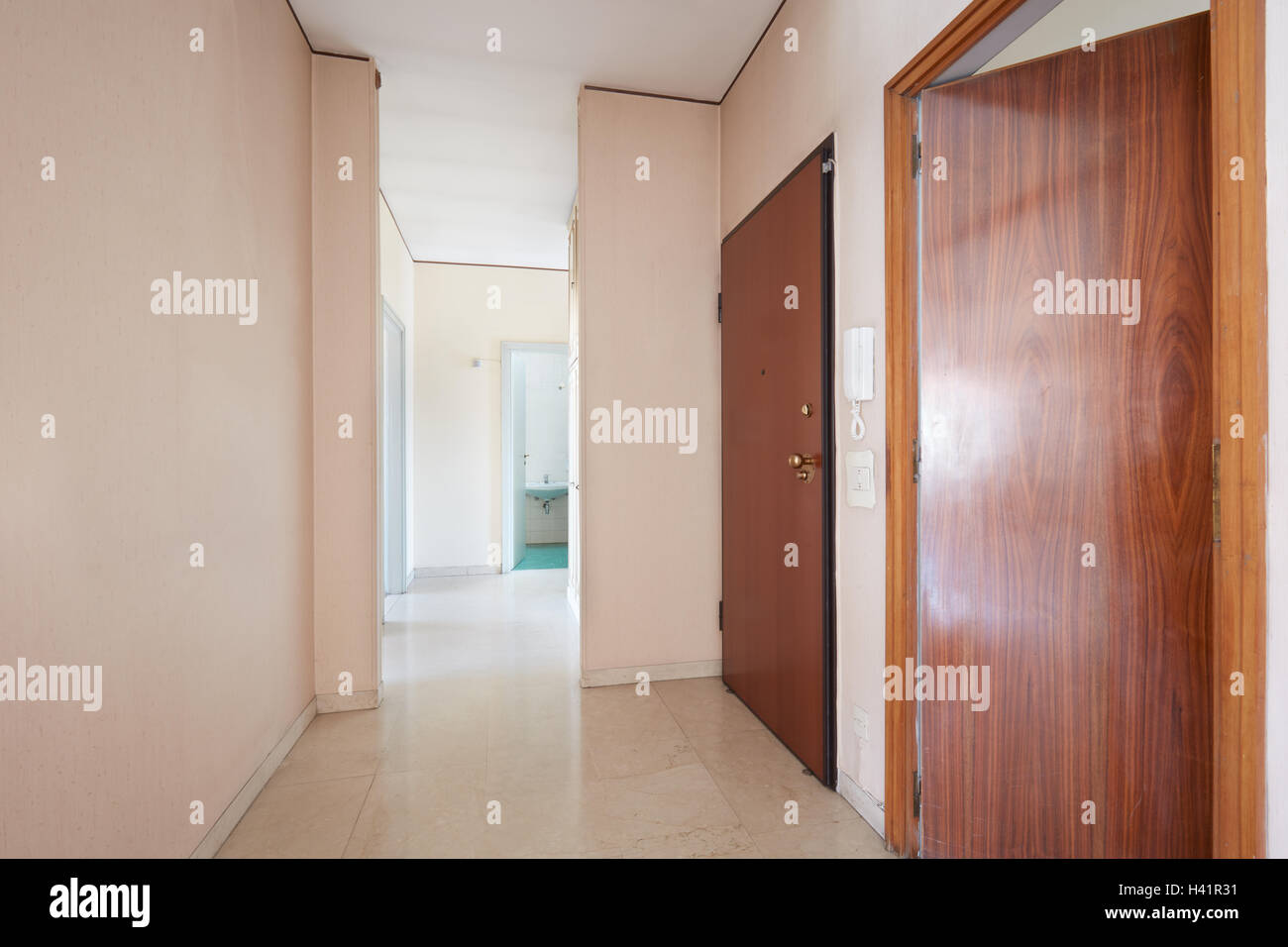 Corridor in empty apartment with marble floor, perspective Stock Photo