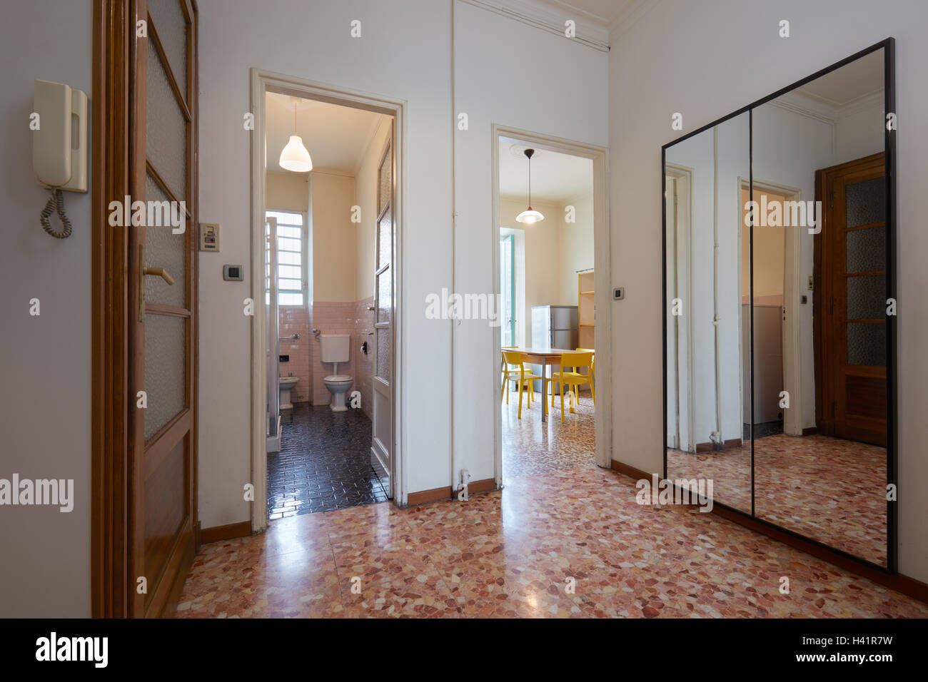 Entrance in normal apartment with tiled floor Stock Photo