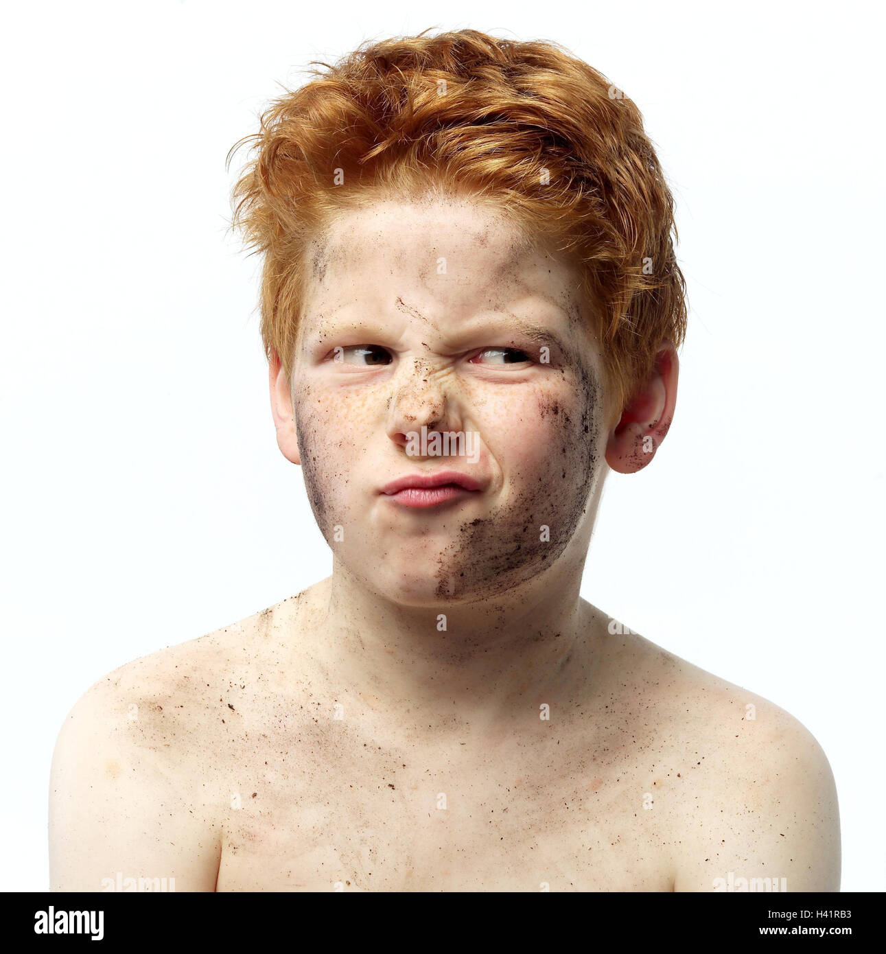 Child boy red haired free upper part of the body dirtily portrait childhood look freckles bodies dirt expression dissatisfied doubtful doubt doubt aversion aversion annoyance studio Stock Photo Alamy