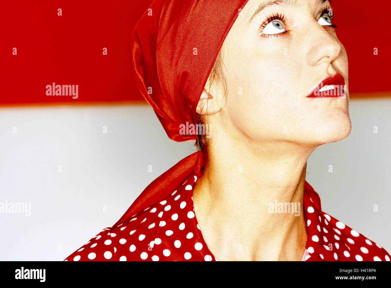 High-looks woman, young, kerchief, blouse,,  Side portrait, broached  Series, women portrait, 25 years, headgear, cloth, top, scored points, gaze upwards, suppliant, inquiringly, uncertainly, insecurity, interest, interests, color mood red, indoors, 20-30 Stock Photo