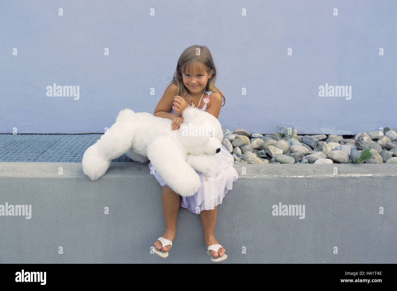 Girls, happy, sit, defensive wall, soft toy, summer, leisure time, house, detail, outside wall, child, long-haired, blond, summer dress, smile, happy, course, teddy bear, nonsense animal, toys, substance bear, 'polar bear', childhood, only, outside, whole Stock Photo