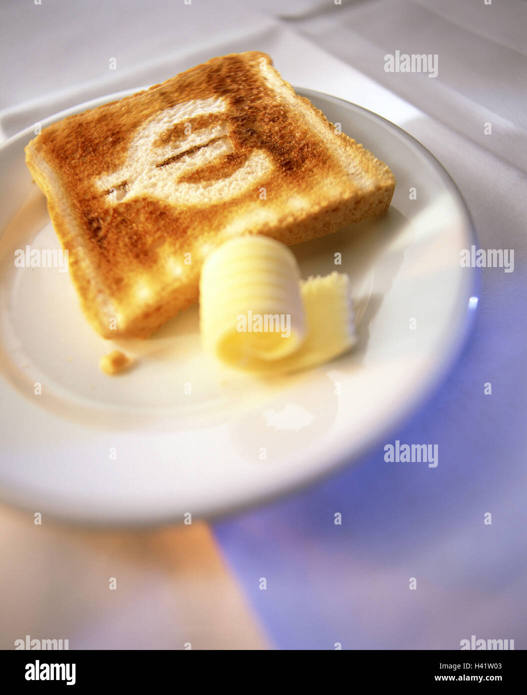 Breakfast table, detail, toast, eurocharacter, toasted breakfast, plate, bread, toast slice bread, toast bread, roasted, silhouette, contours, euro, currency figure, euroicon, currency sign, left blank, currency, European, butter, little butter role, icon Stock Photo