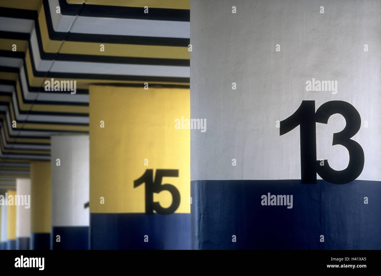 Parking structure, columns, numbering,  Numbers,   Buildings, architecture, park deck, pillars, three-colored, yellow, white, blue, labeling, numbers, numbers, 13, 15, number, digit, graduation, selection, hint, bearings, enumeration, parking place, symbo Stock Photo