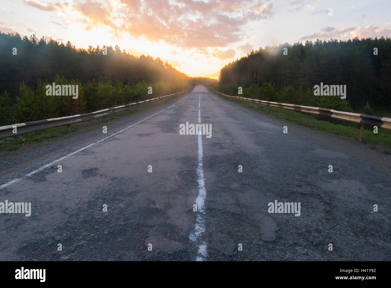 Sunset over empty freeway Stock Photo - Alamy