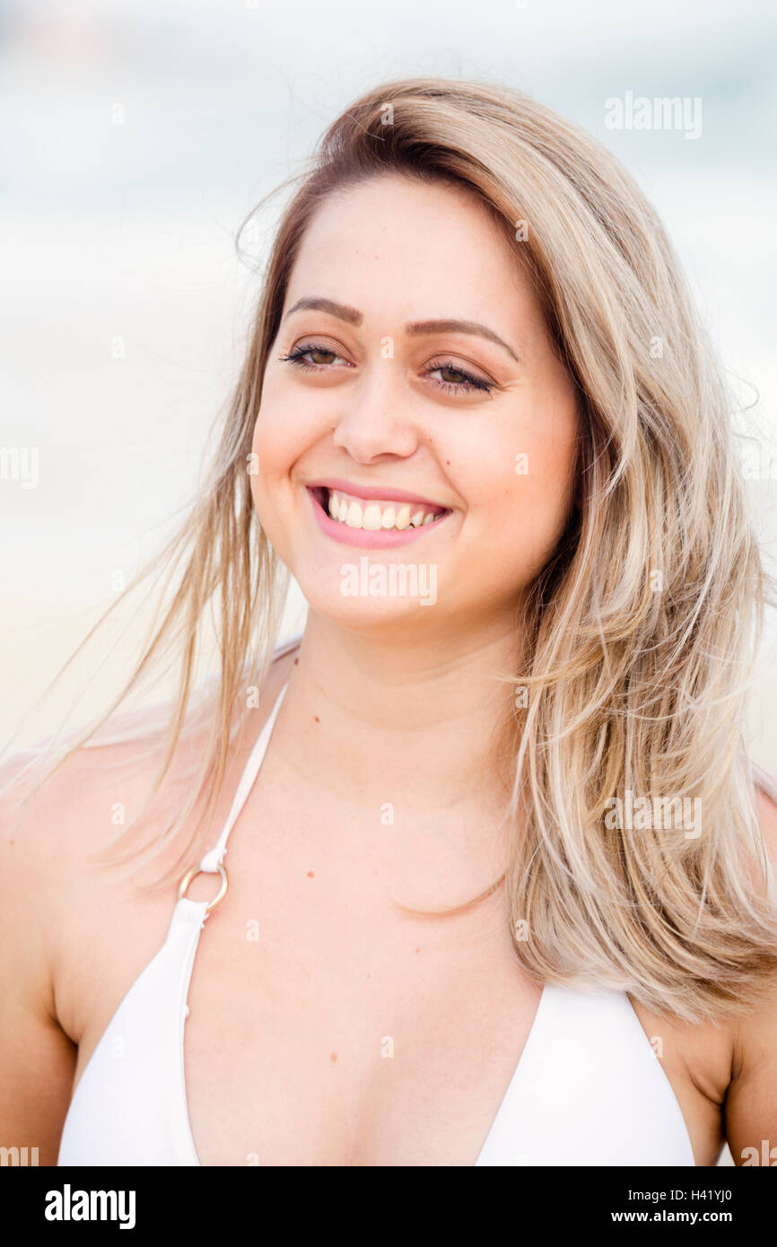 Smiling Mixed Race woman wearing bikini Stock Photo