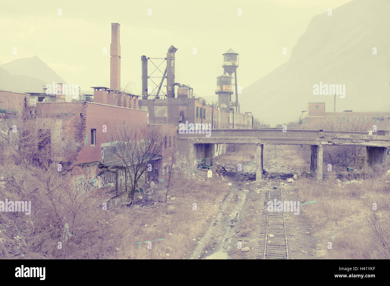 Dilapidated factory near railroad tracks, Detroit, Michigan, United States Stock Photo