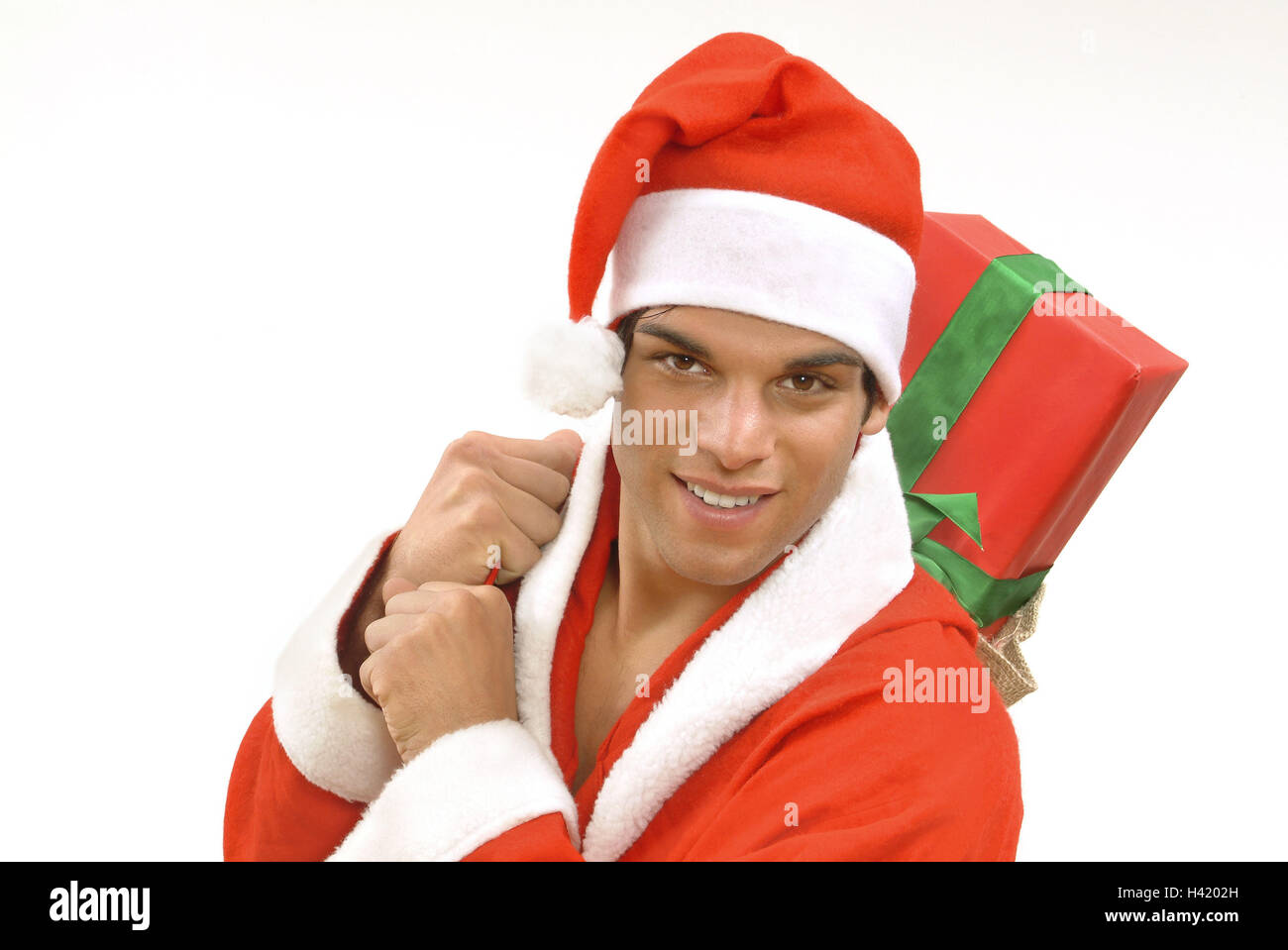 Man, young, Santa's costume, packages, carry, portrait, man's portrait, 20-30 years, dark-haired, person, smile, bring friendly, happy, view camera, Santa's hat, Christmas cap, pointed cap, headgear, Santa Claus, Santa Claus, Santa, present, Christmas pre Stock Photo