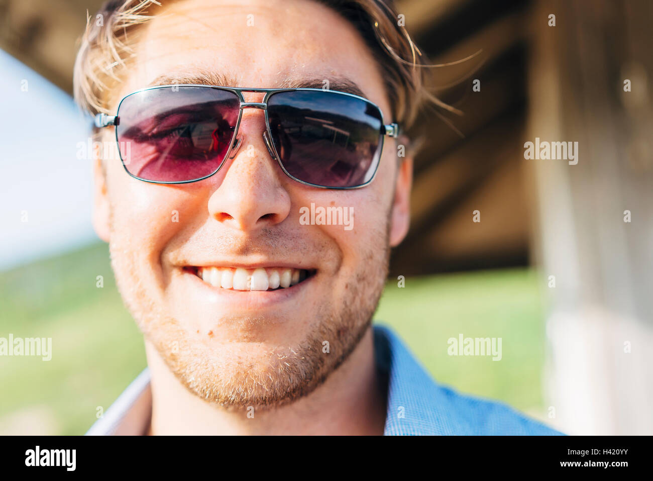 Smiling Caucasian man wearing sunglasses Stock Photo