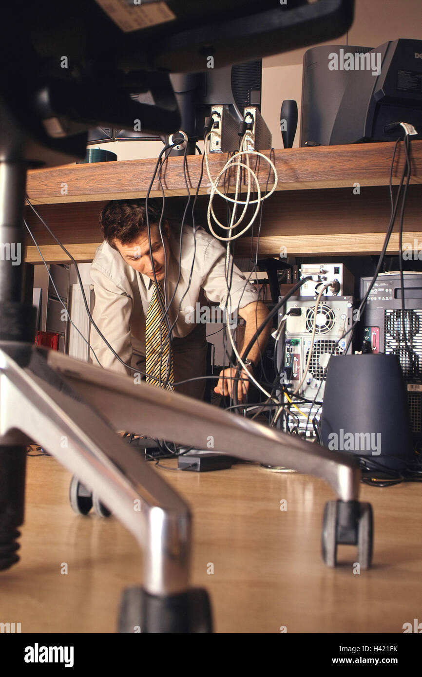 Office, desk, computer, man, kneel, check connections, cables, workplace, table, PC, monitor