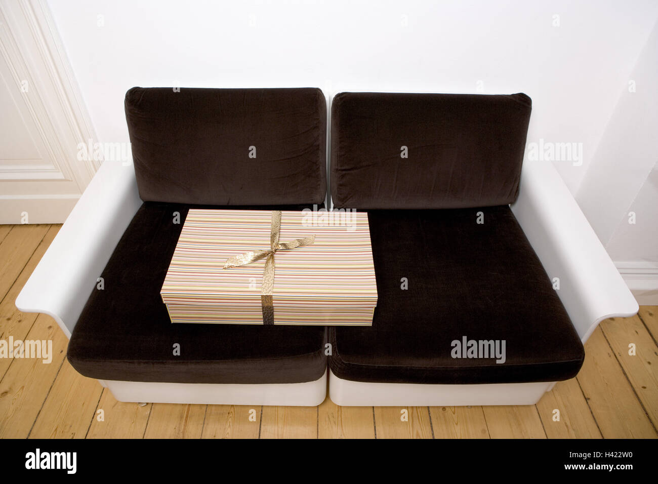 Sofa, gift,,     Furniture, upholsteries, two-seaters, cushions, brown, package, birthday gift, Christmas gift, surprise, package, gift package, gift band, quietly life, interior, Stock Photo