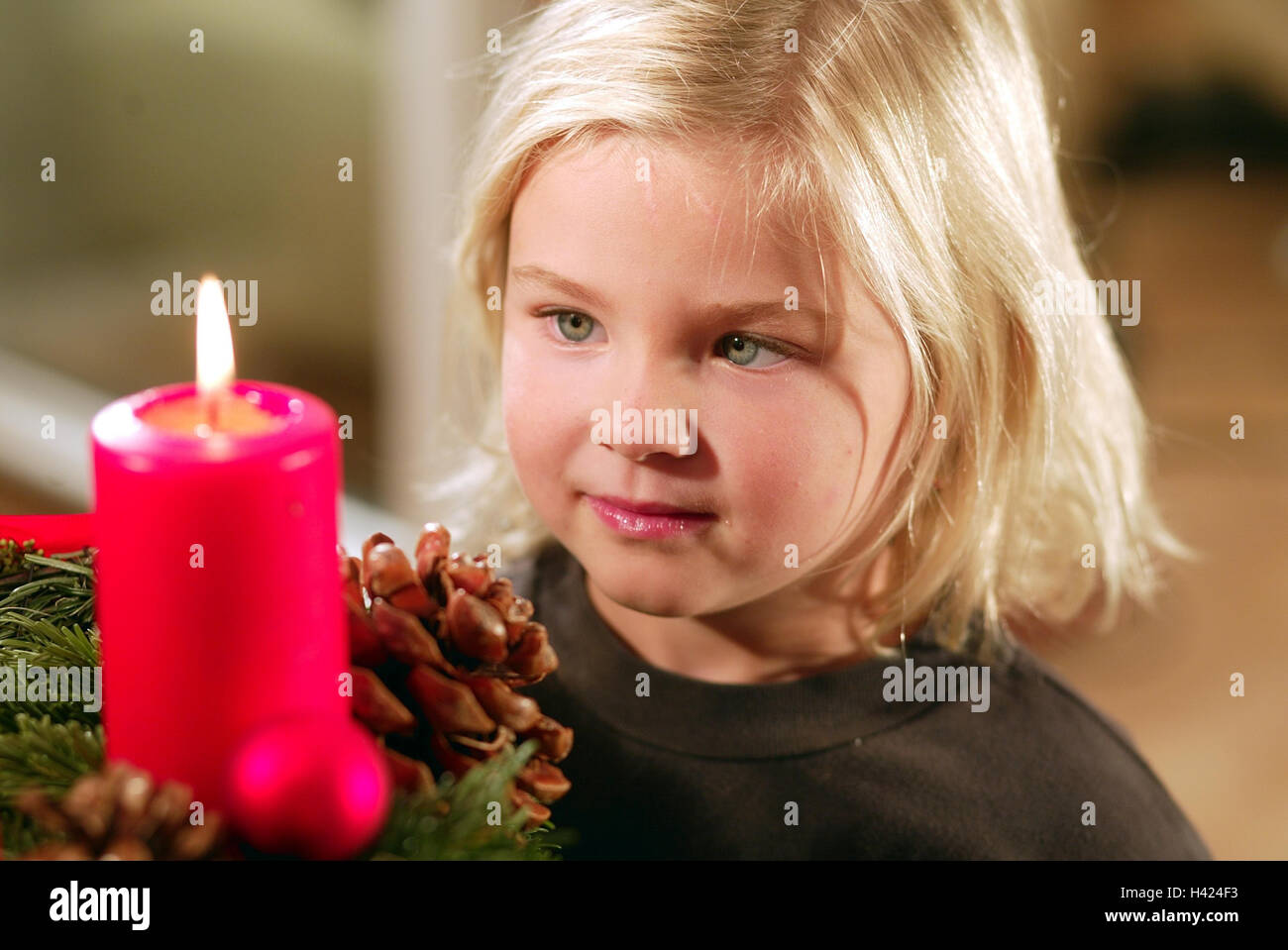 Advent wreath, detail, candle, burn, girls, excommunicated, portrait, inside, at home, child, 6 years, Christmas, yule tide, for Christmas, Advent season, joy, expectation, expectantly, entrancedly, fascination, childhood, Advent candle Stock Photo