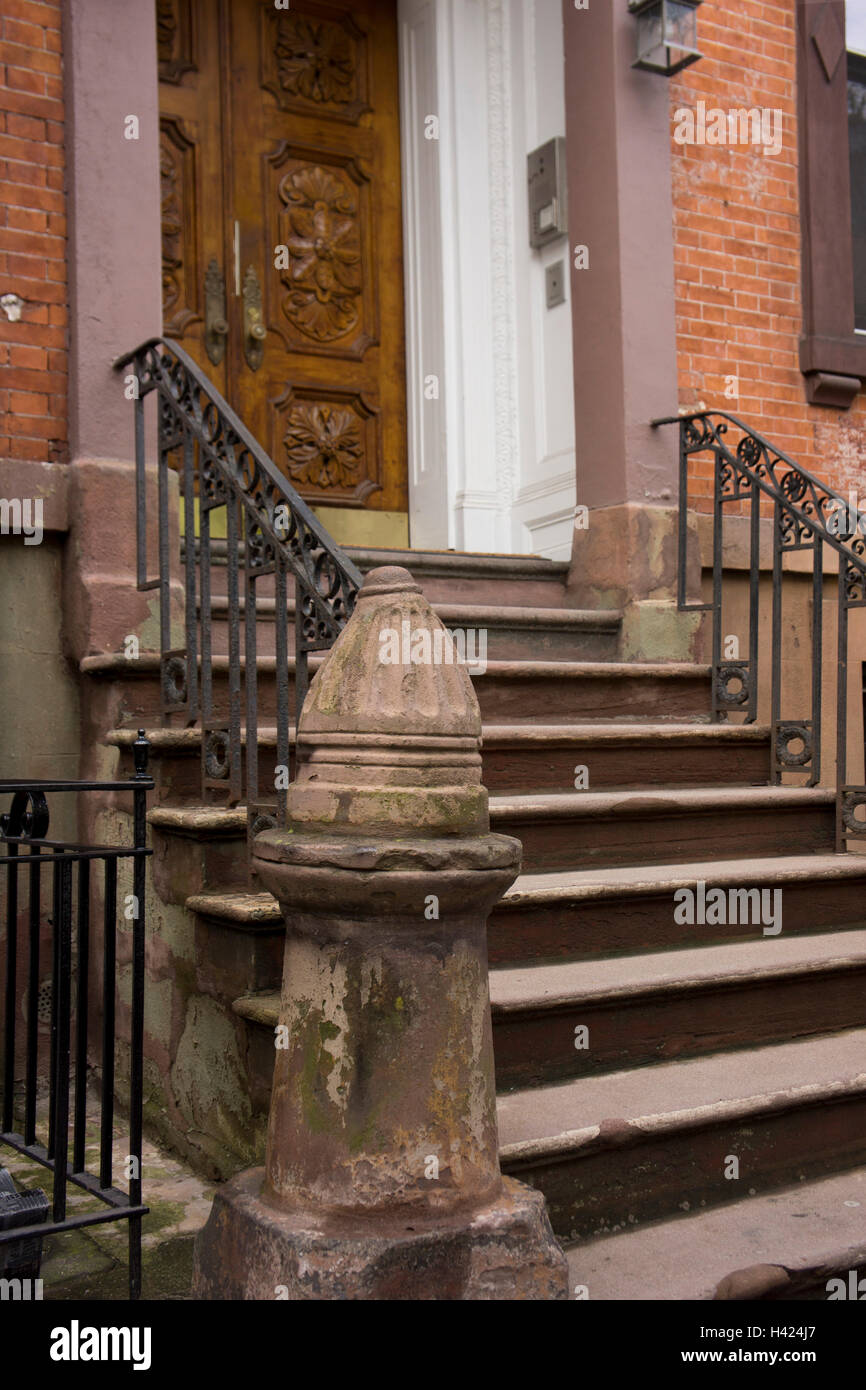 19th c. door stoop with massive newel post in Chelsea, Manhattan, New York. Stock Photo