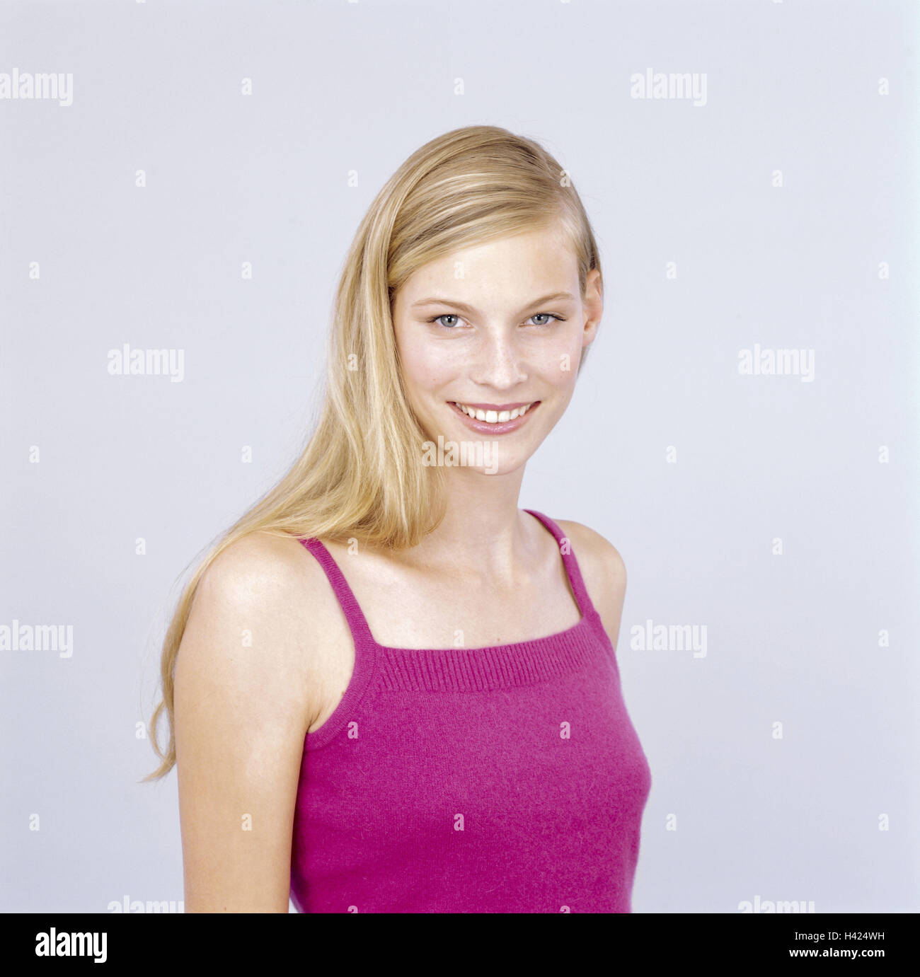 Youthfully, blond, view camera, smile, portrait, freely for Großflächenplakatierung 16-20 years, 20-30 years, woman, young, long-haired, top, naturalness, do not stand, friendly, balance, happy, joy, happy, luck, mood positive, studio Stock Photo