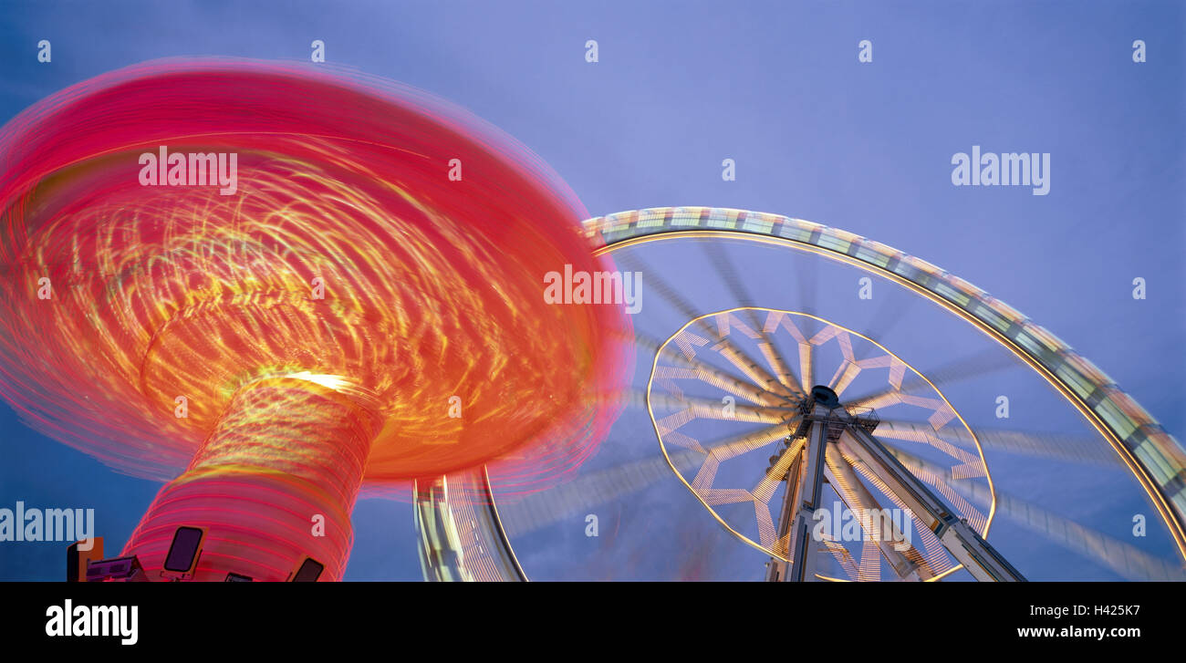 Giant wheel, Kettenkarussale,  illuminate, movement,  Fuzziness, evening, detail Festival, Kirmes, party, driving business, showmen, attraction, leisure time, fun, enjoyments, height, gondolas, carousel, lights, turning, kinetic blurring, twilight, panoramic format Stock Photo