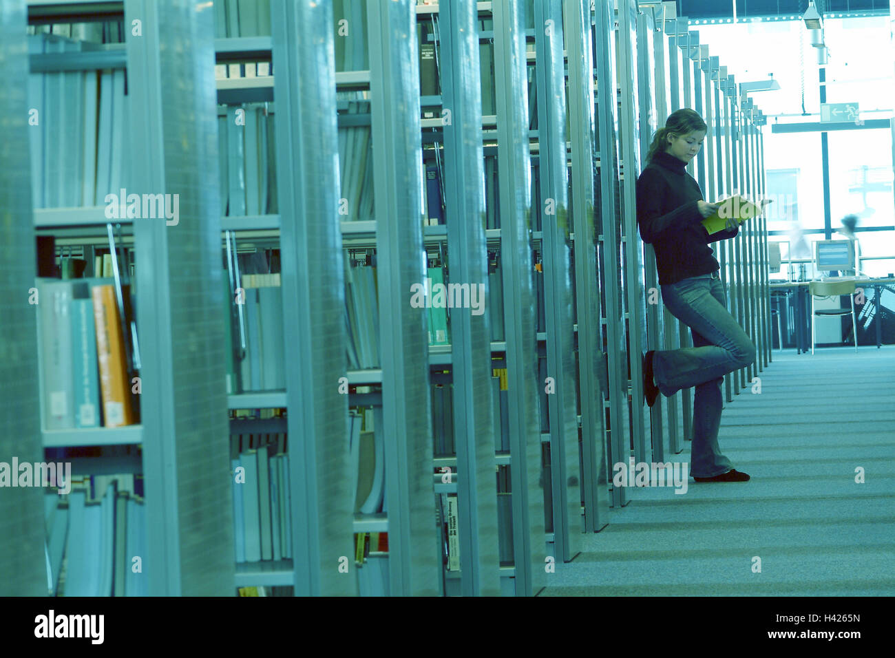 Library, bookshelves, woman, young, stand, read book, side view ...
