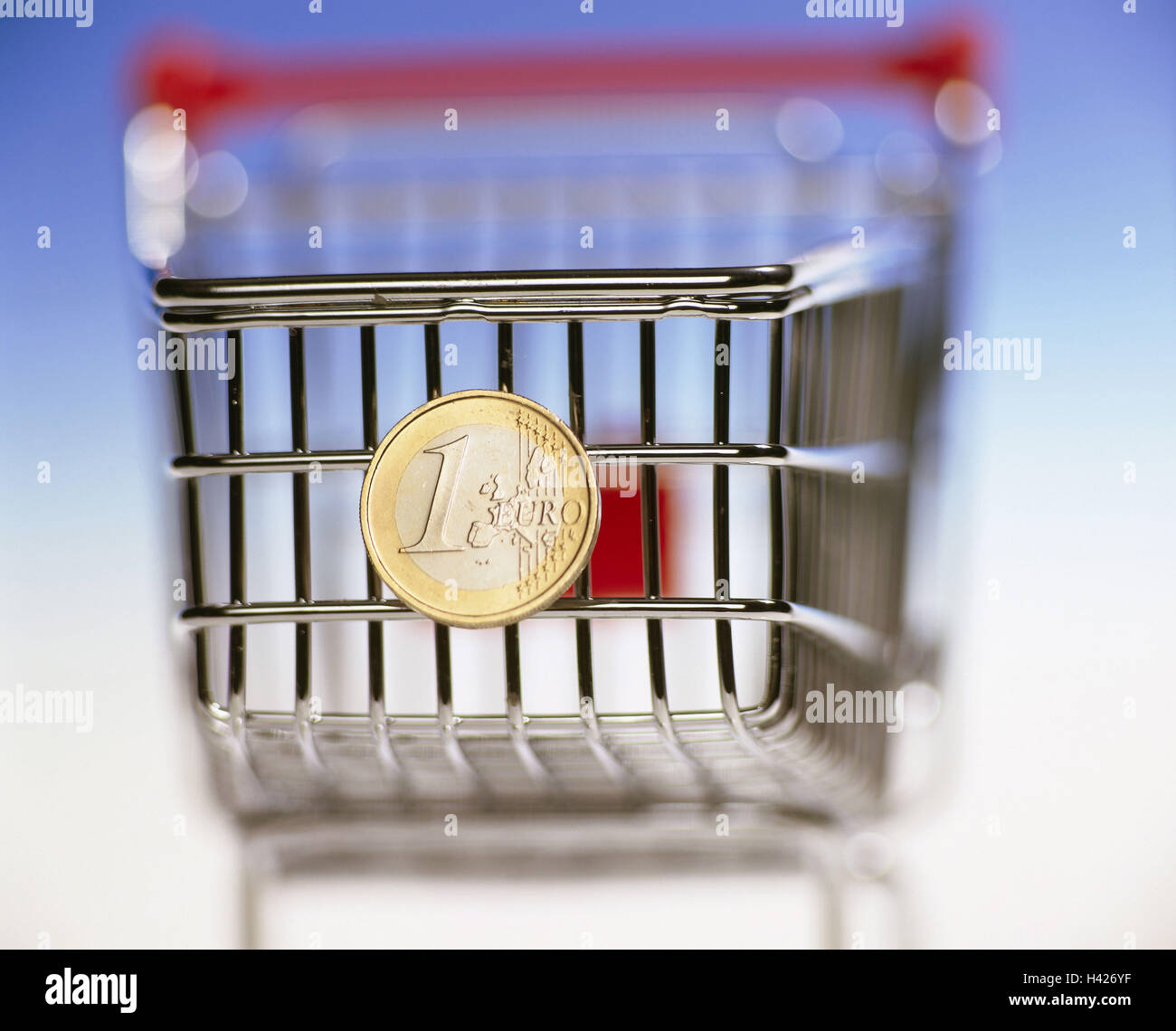 Shopping carts, euro coin miniature shopping cart, euro, coin, currency, Europe, means payment, European, value, buying power, finances, economy, consumption, purchasing, shop, carriage security, icon, conception, Still life, product photography, blur, st Stock Photo