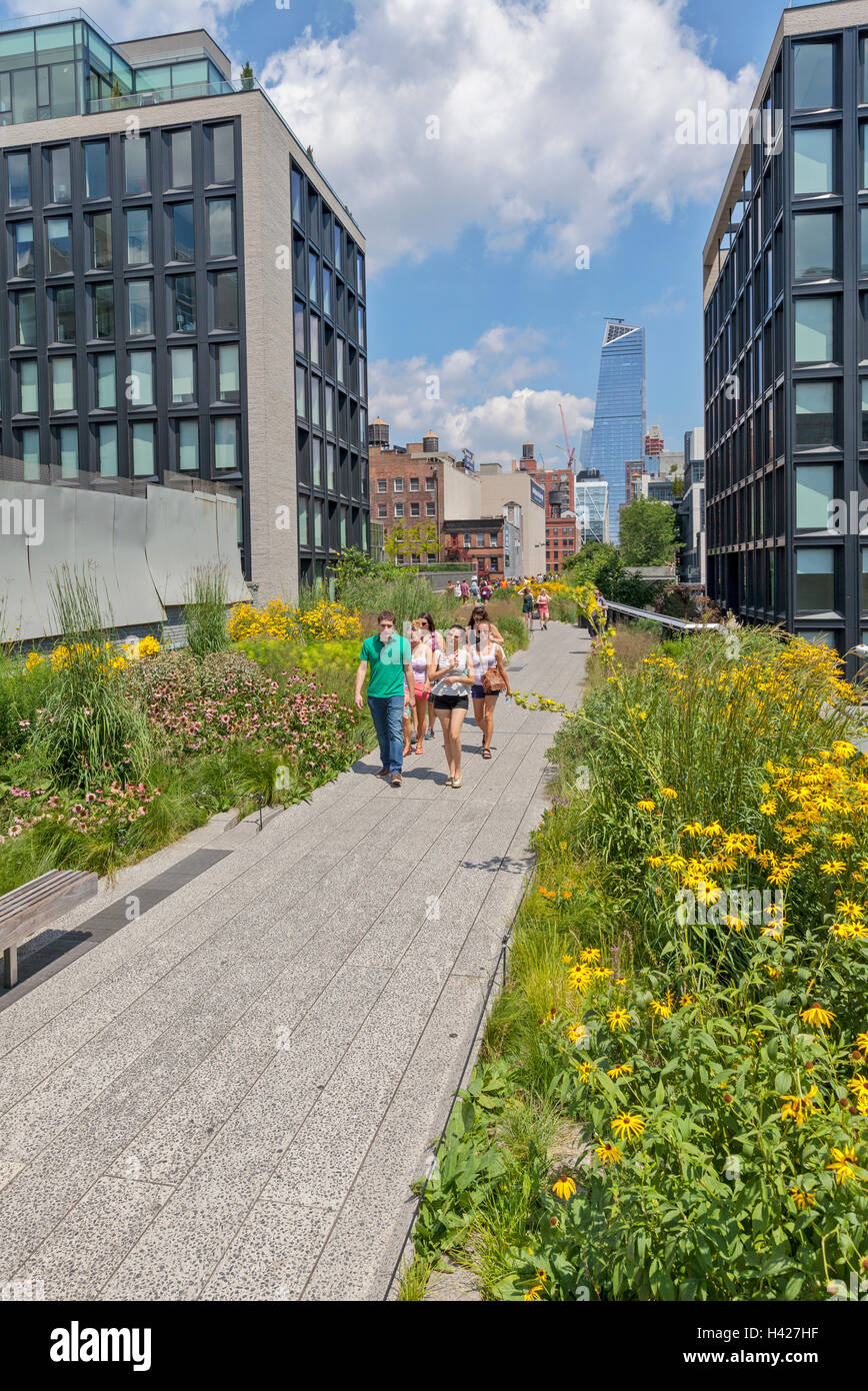 People walking and enjoying The New York City High Line Park. Stock Photo