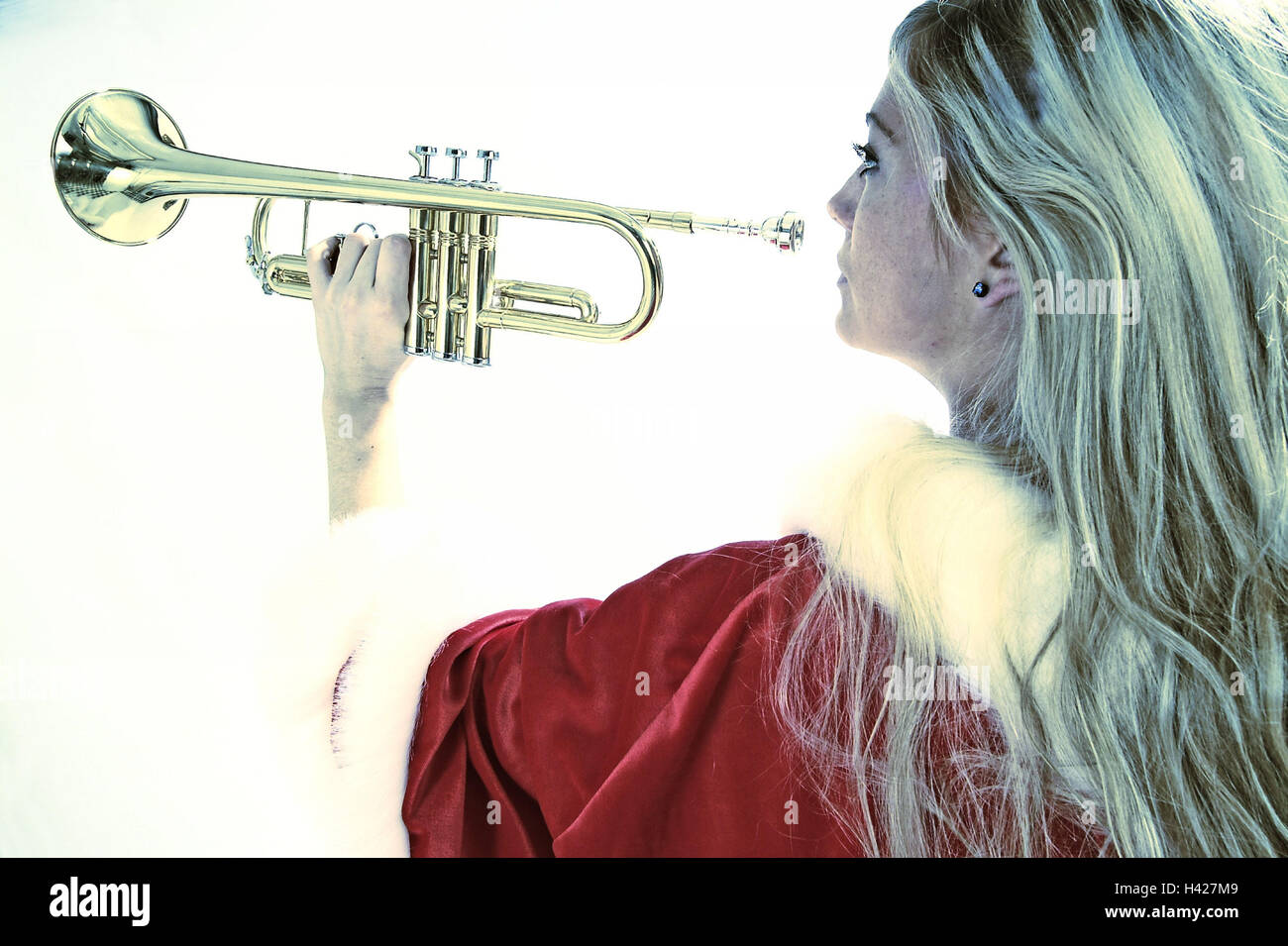 Christmas woman, trumpet, music,  view from behind, detail, Stock Photo