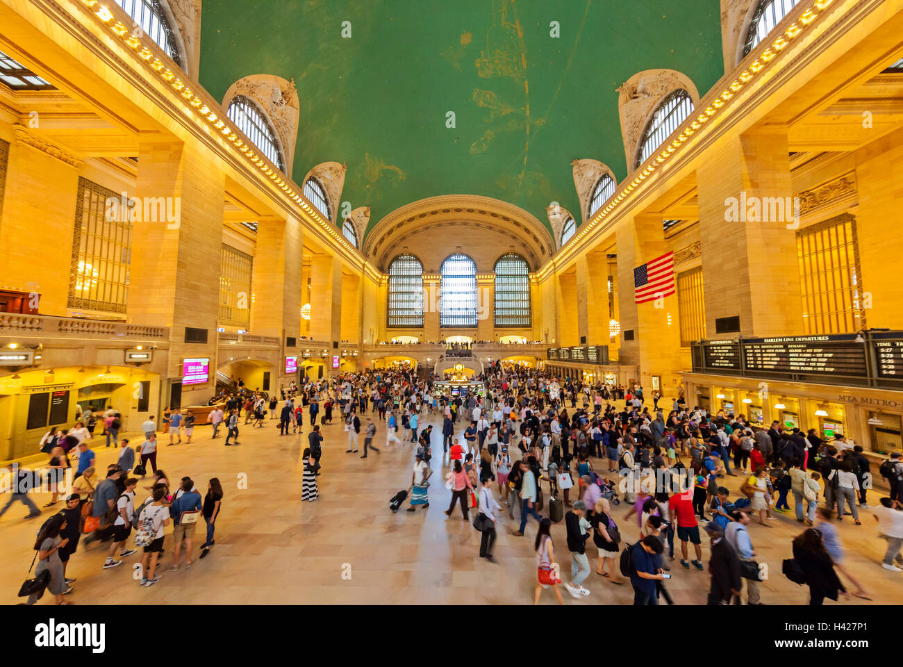 An interior view of Grand Central Station in New York City with all the travelers. Stock Photo