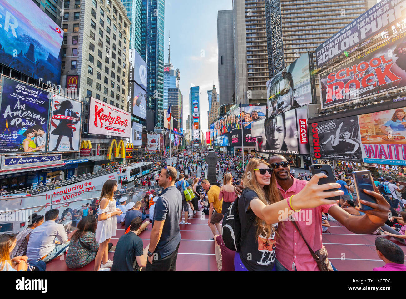 Tourists taking selfies in Times Square, New York City, New York. Stock Photo