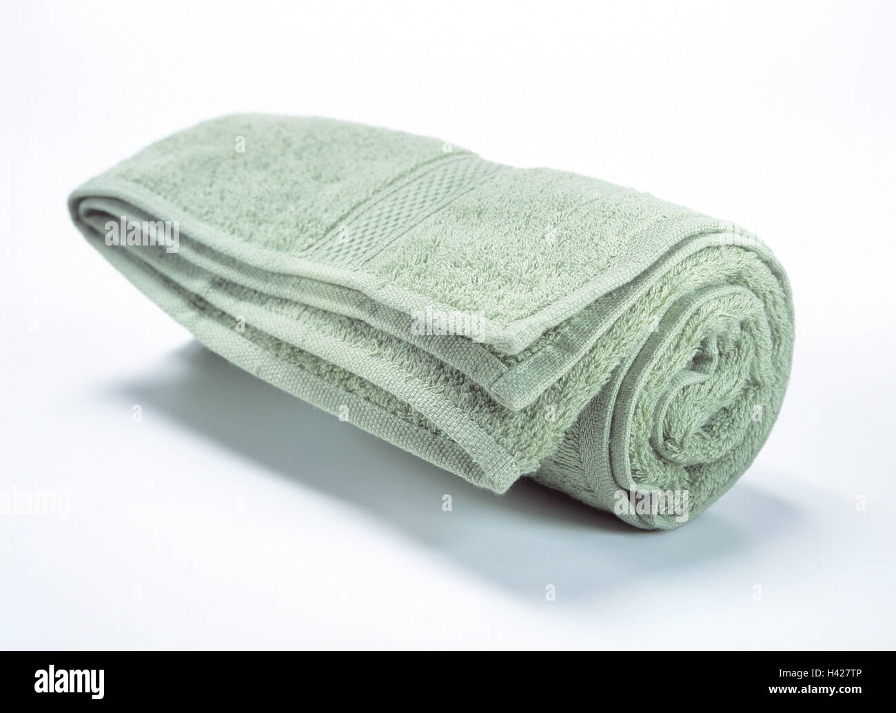 Towelling towel, green, scrolled towel, dry cloth, terry cloth, substance, structure, fleecily, softy, rolled up, dry, dry up, conception, personal care, body hygiene, hygiene, Still life, product photography, studio, cut outs Stock Photo