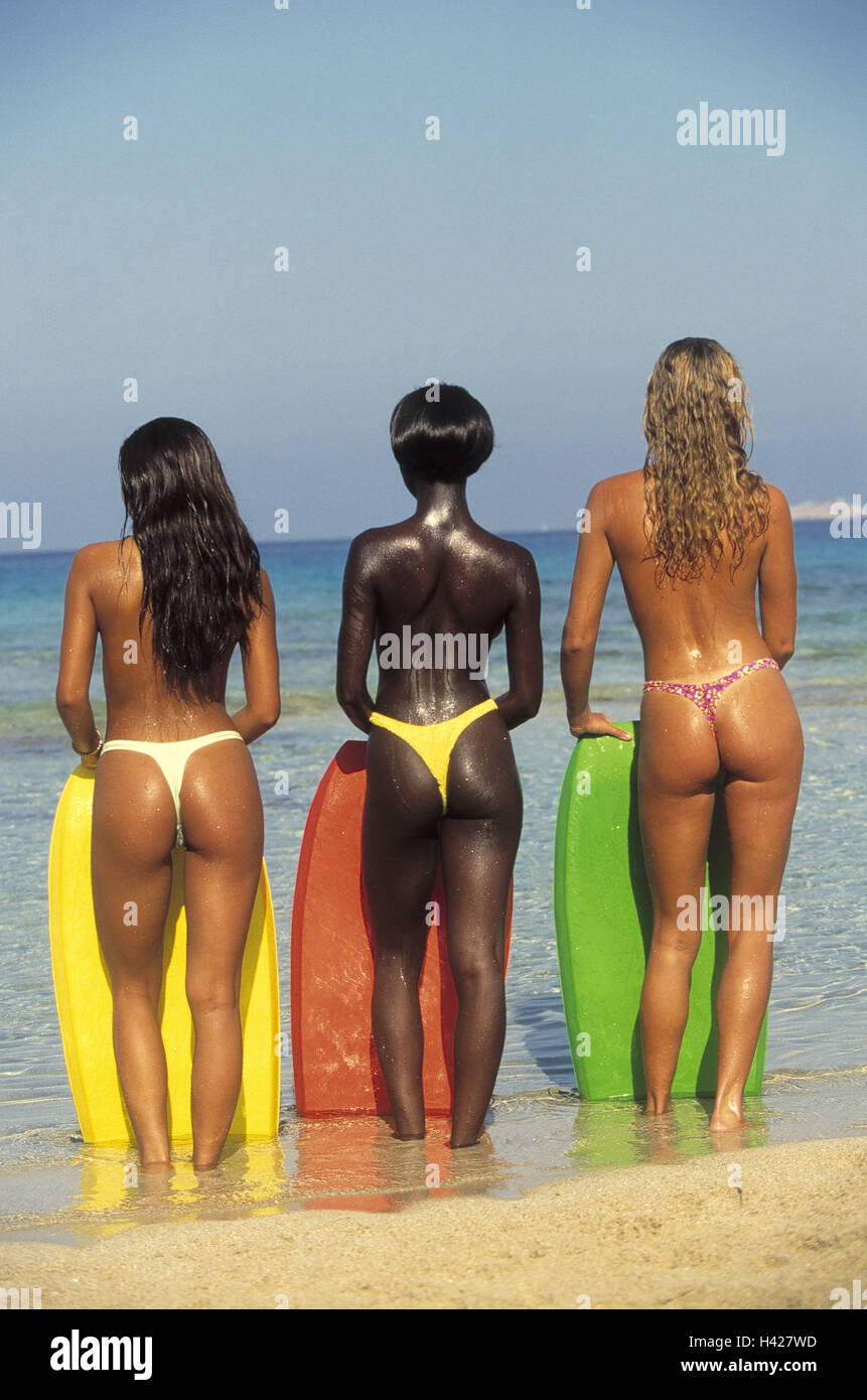 Sea, women, skin colors, different,  Stringtanga, stands, back opinion,  Bodyboards 20-30 years, young, figure, slim, mixed ethnically, friends, three, upper bodies freely, string, Tanga, vacation, recuperation, relaxation, leisure time, summers, summer vacation, bath vacation, swims waits, water, wave, wave boards, whole bodies, Stock Photo