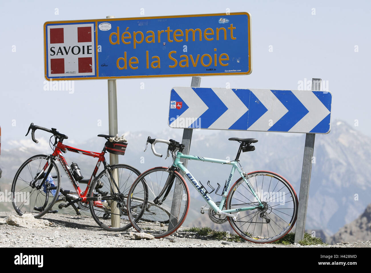 Sign 'Departement de la Savoie', 2 racing wheels, alp scenery Stock Photo