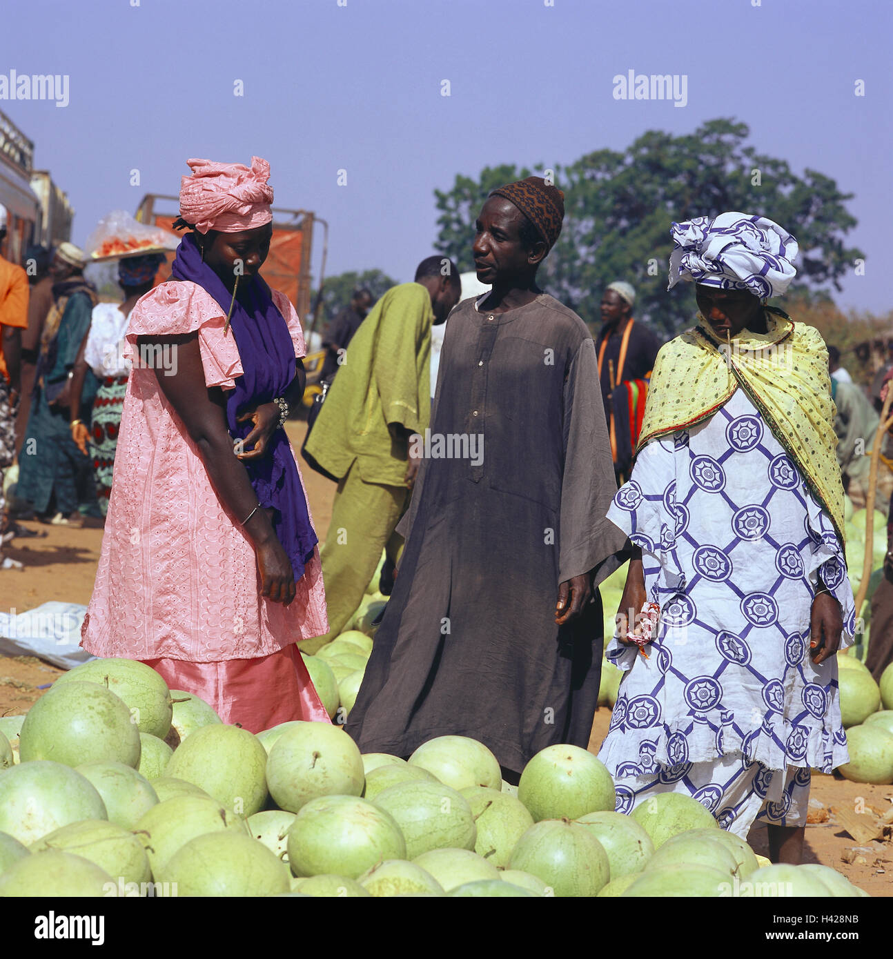 Senegal, Kaolack, market scene, Africa, West Africa, economy, trade, sales, market, market beating out, women, man, person, Senegalese, swarthy, clothes, traditionally, headscarfs, dealers, customers, fruits, fruit, watermelons, melons, outside, Stock Photo