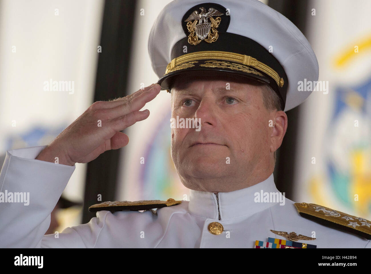 U.S. Northern and NORAD Commander Bill Gortney renders honors as he is piped aboard during the change of command ceremony at the Peterson Air Force Base May 13, 2016 in Colorado Springs, Colorado. Stock Photo