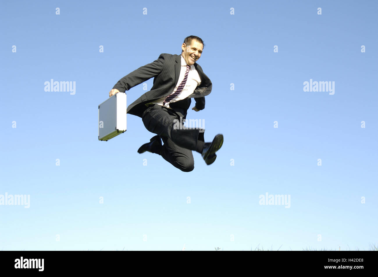 Man, suit, suitcase, caper, jumping, joy, motivation, success, business