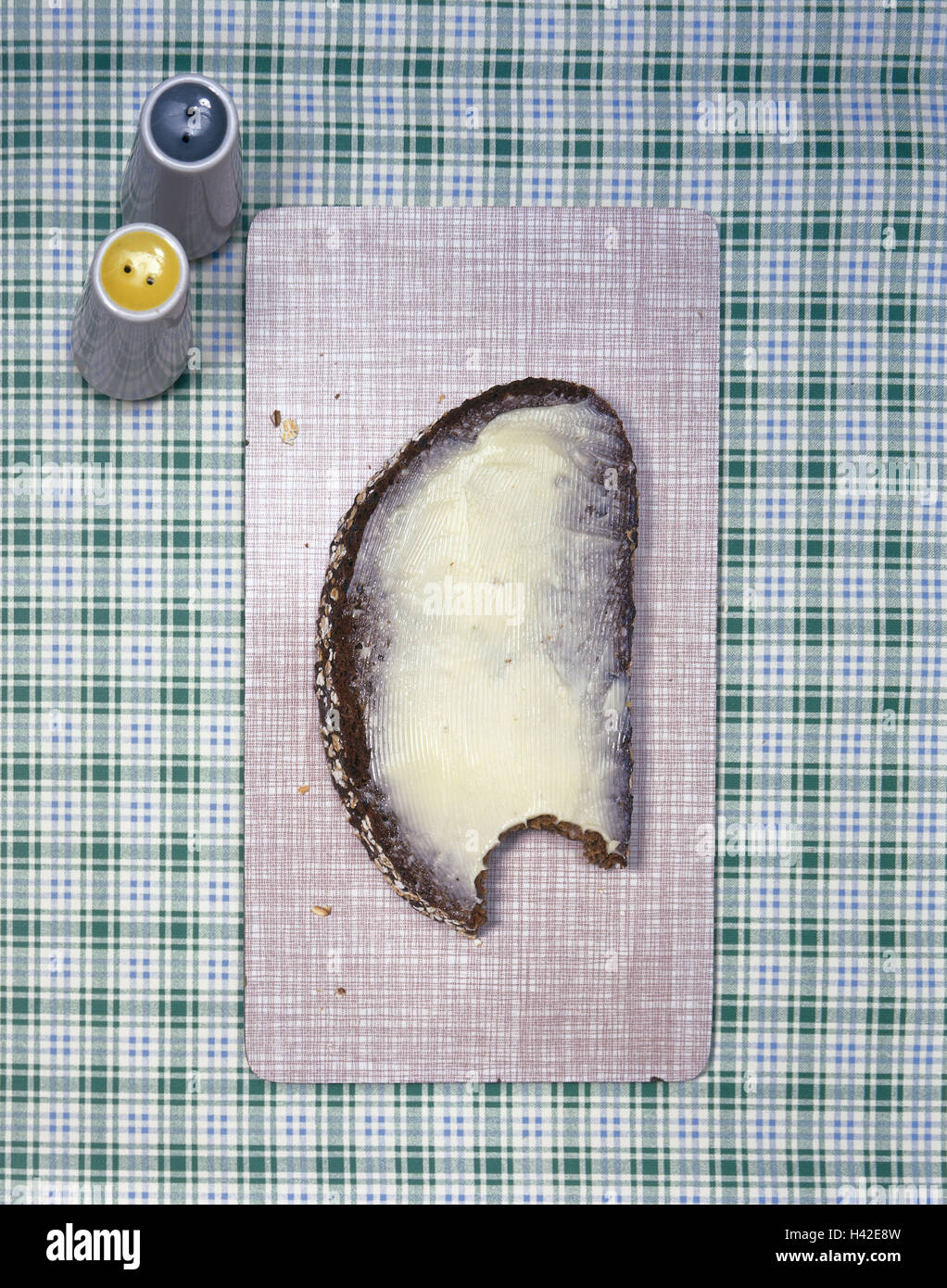 Bread and butter, bitten into, salt-cellar, pepperpot, from above, food ...