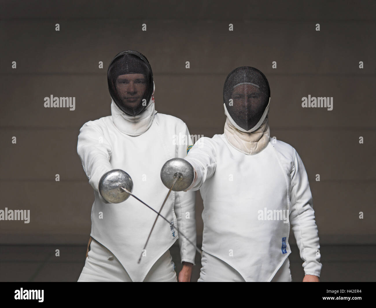 Fencers, tinkles crossed   Men, two, sport, sports, fencing, Degenfechten, swords, foil, push arms, discipline, duel, duel, contest, competition, Fechtkleidung, masks, protection, Fechtmasken, protection clothing, arms, opponents, adversaries, series Stock Photo