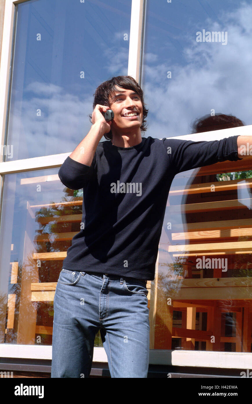 Man, young, smile, mobile phone call up, window, lean adult, 20 - 25 ...