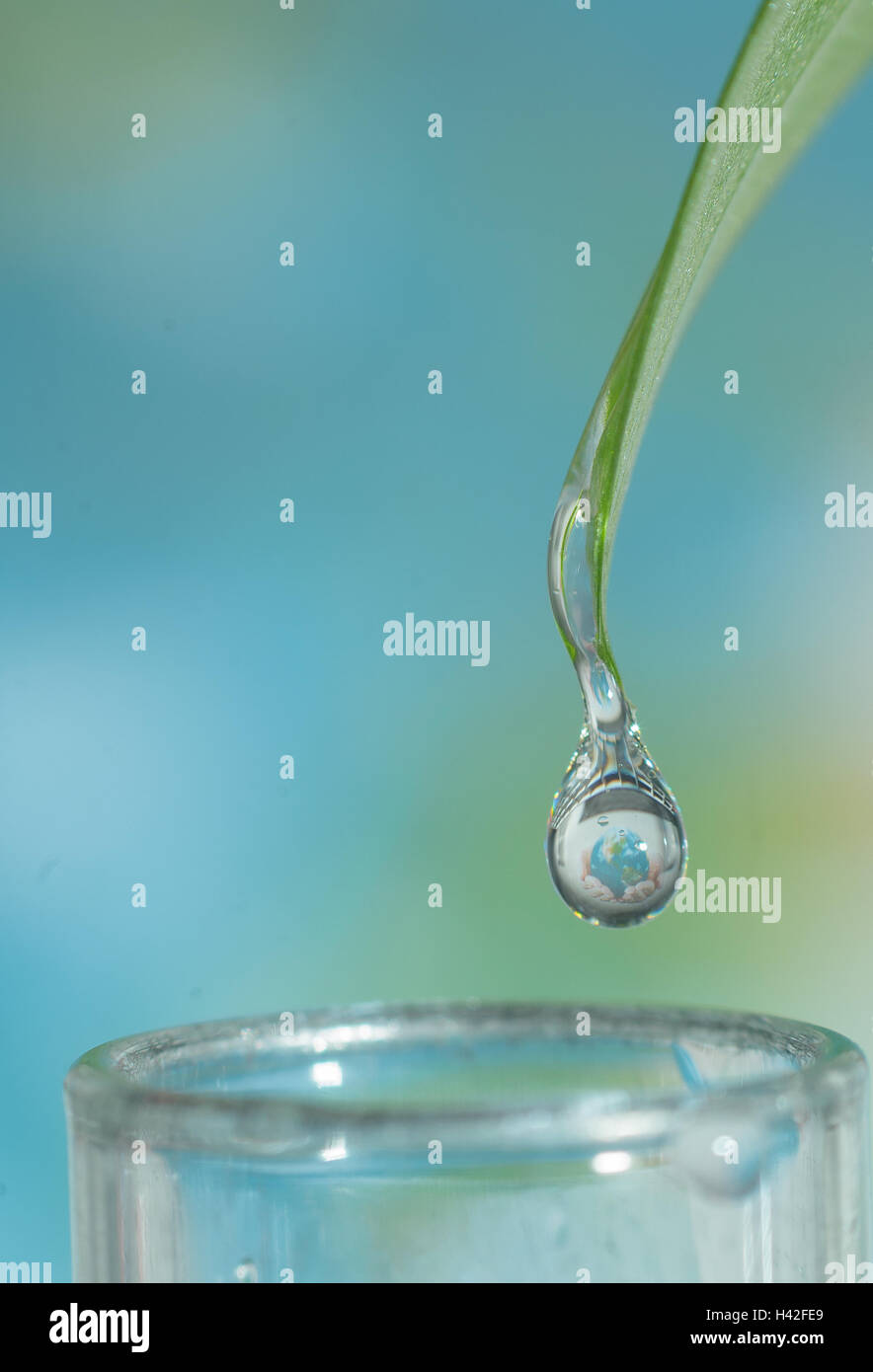 Closeup of water drop with earth sphere reflection Stock Photo