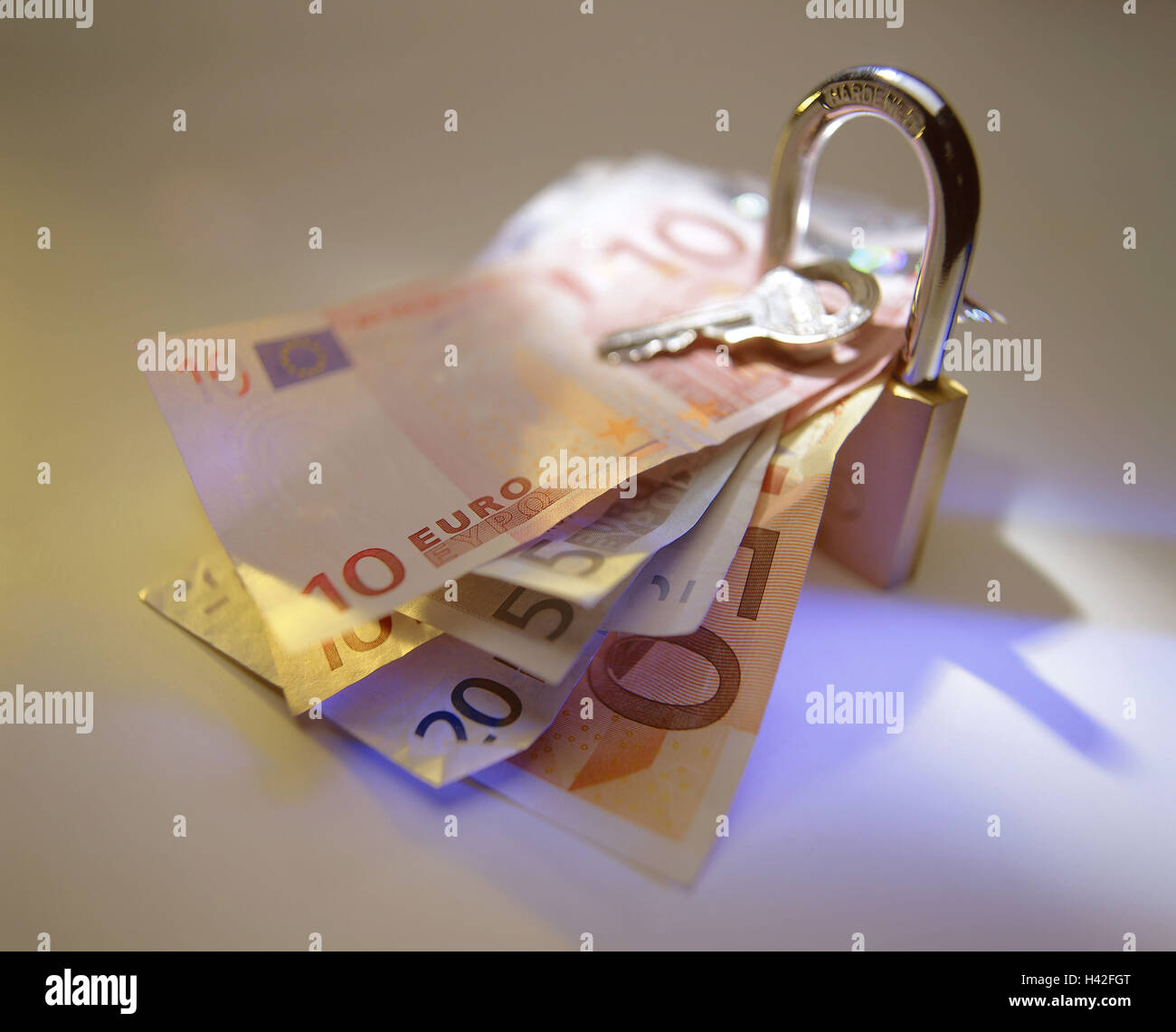 Padlock, bank notes, euro, key, blur security lock, security, stuck, hold on, clamp, saving, saving, economy measure, banknotes, meanses payment, money, notes, currency, monetary policy, conception, Still life, product photography, studio Stock Photo