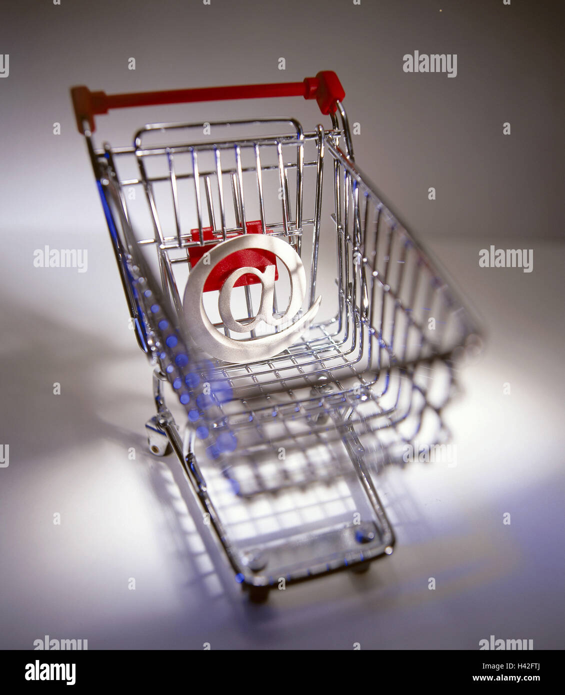 Shopping carts, at-sign, icon, Internet shopping make purchases, shops, shopping, purchasing, technology, trade, digitally, e-commerce, Internet, teleshopping, teleshopping, Internet shopping, Internet trade, online, miniature shopping carts, At, At icon, Stock Photo
