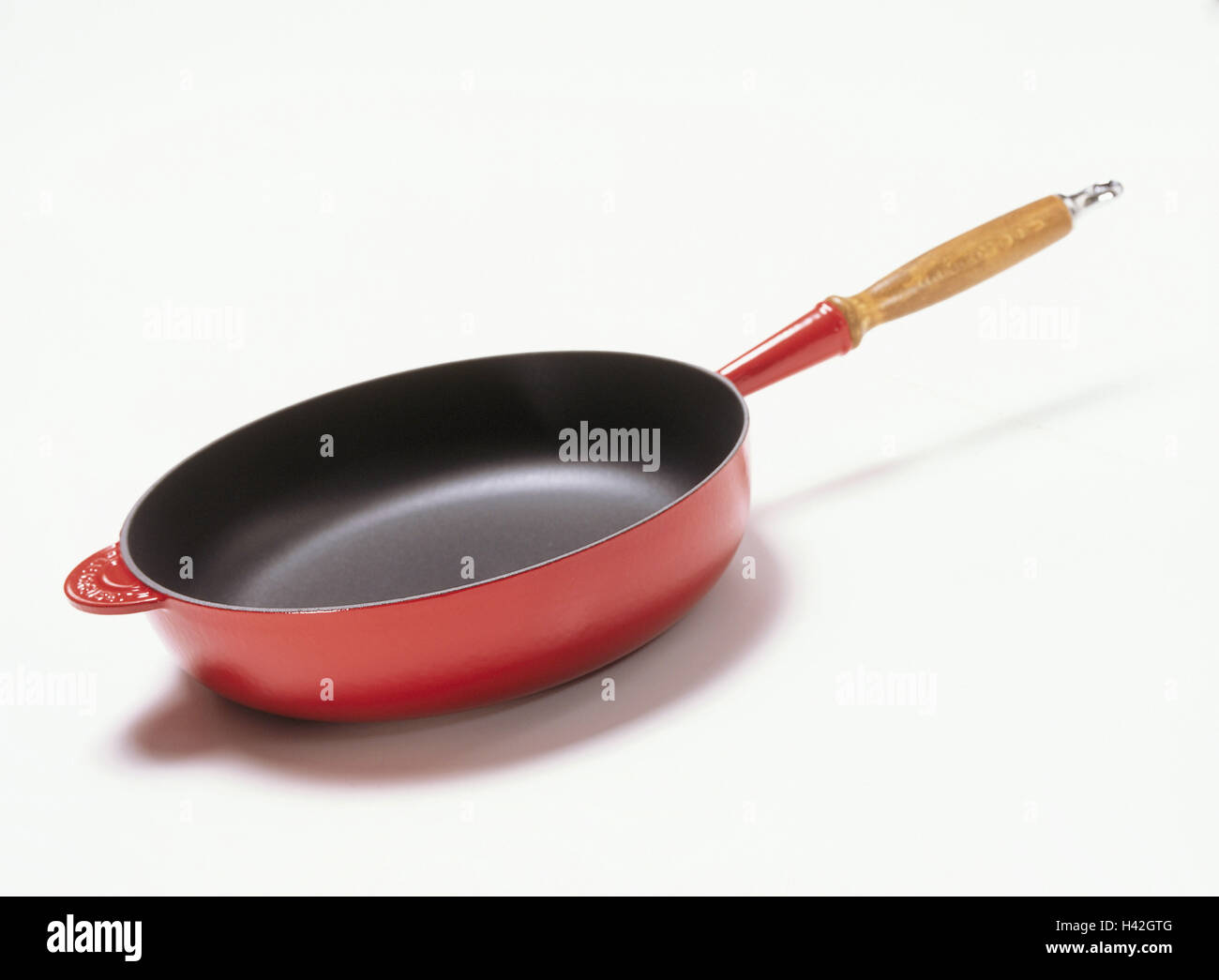 Frying pan, red pan, wooden grip, handle pan, household articles, culinary articles, cook, roast, cuisine, Still life, product photography, studio Stock Photo