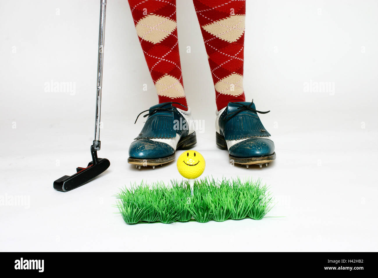 Person, Golf clothes, detail, feet, golf clubs, art turfs, tea, Golf ball, smiley young, 20-30 years, golfer, golfer, golfer, golfer, turf, art grass, grass, artificially, ball, mini-golf, punt, putting, lawn, Indoor, T, sport, golf, golf, to Golf, practi Stock Photo