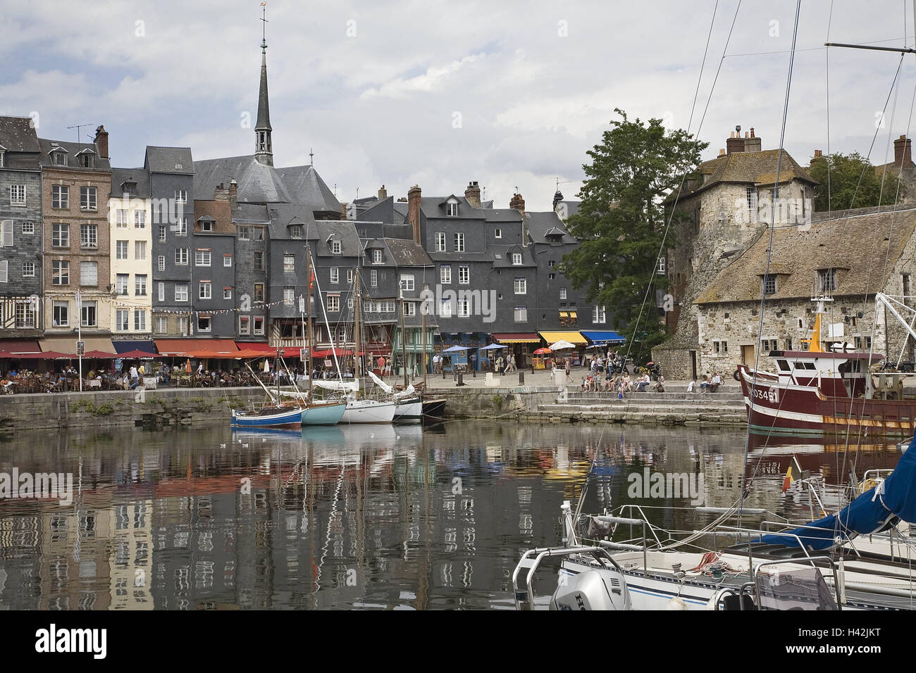 France, Normandy, Honfleur, old harbour, 'Vieux basin', town, townscape, port, houses, buildings, picturesquely, old, harbour basins, boots, Idyll, sailboats, sailing ship, house facades, oblique-panelled, harbour promenade, restaurants, fishing trawlers, church, steeple, wooden band, Ste-Cathérine, Stock Photo