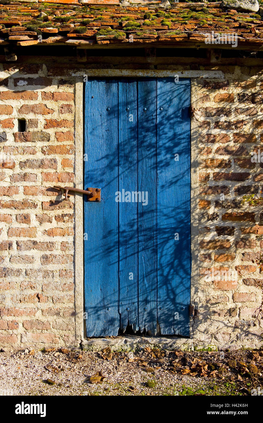France, Burgundy, Saône-et-Loire, Chateau de Sully, brick building, detail, wooden door, blue, Stock Photo