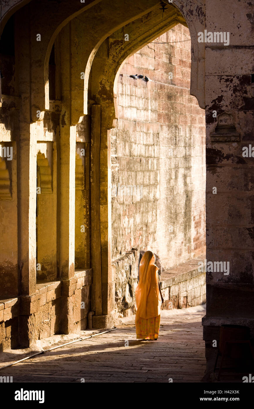 India, Rajasthan, Jodhpur, Meherangarh, fortress arrangement, lane, woman, sari, back view, Stock Photo